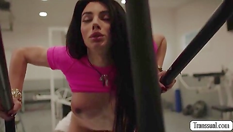 Brunette gym instructor rimming with her ass for the guy in the gym