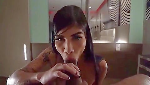 Brunette is getting deepthroated on the bed and gets nailed